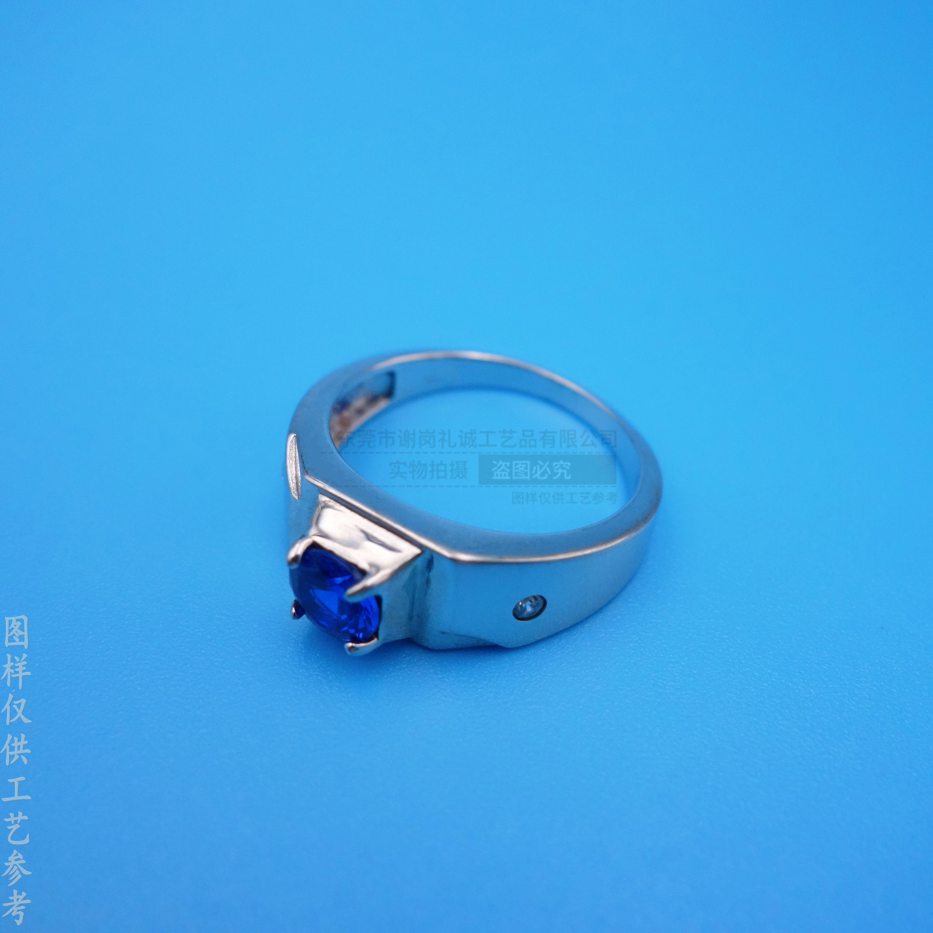 Blue stone inlay with zircon