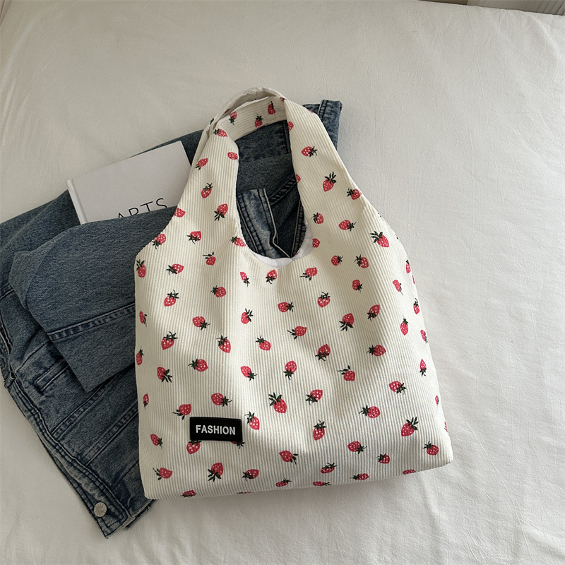 Bolso de meandruño 2024 nuevo hombro de gran capacidad bolso de mano de transporte literario versátil impresión brazaleta