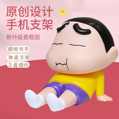 アニメのクレヨンの小さい新しい携帯電話のタブレットのスタンドの子供の頃の怠け者のネットの赤いアニメの手は湿ってかわいい子供の置物を遊びます。