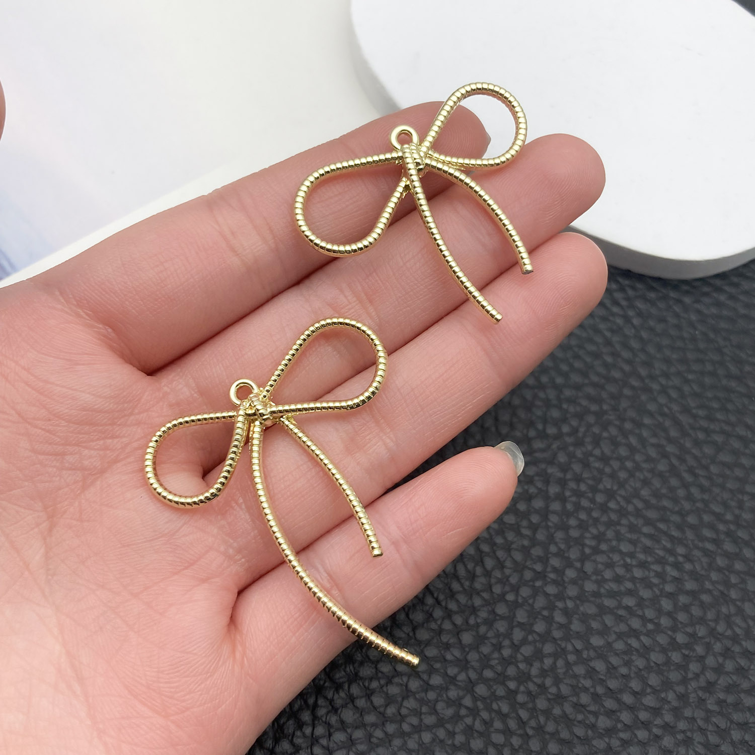 21396-DL-kc金保色锌合金长麻绳蝴蝶结44x36mm