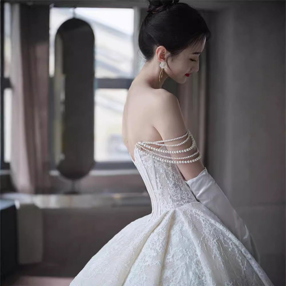Vestido de novia sin tirantes, nuevo estilo 2026, estilo francés forestal, ligero, con textura vintage, adecuado para figuras pequeñas y de talla grande, con cola.