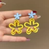 Blue and yellow hollow flower earrings