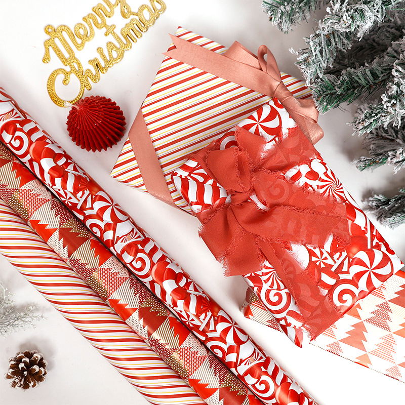Amazon venta caliente super volumen de papel de embalaje de regalos de Navidad soldados Lollipop multicolor ciervo papel de embalaje de rollo