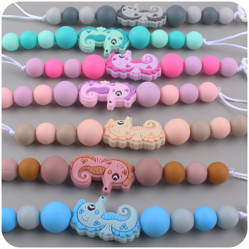 Nuevo bebé suministros chupete cadena creativa de dibujos animados caballito de mar silicona bebé mordedura molar anti-gota cadena