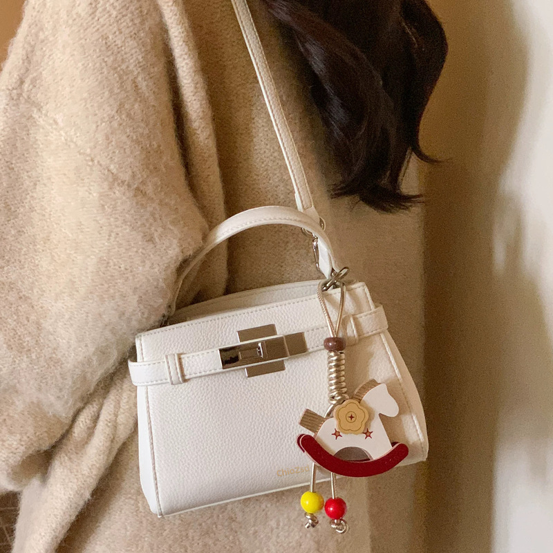 White mini Kelly bag for women, high-end handbag, versatile crossbody bag, stylish commuter shoulder bag with clasp