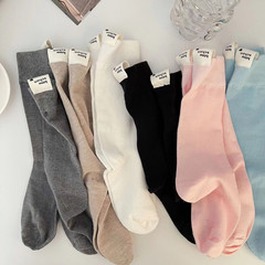 Japanese-style women's socks with macaron solid color trendy medium-calf cotton socks, English letter heel fabric label candy pile socks