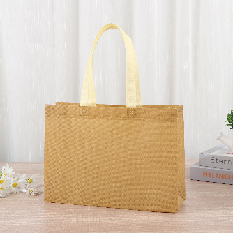 Bolsas de tela no tejida tiendas de souvenirs de viajes de madres y bebés en línea bolsa de compras de mano engrosada bolsa de mano image 9