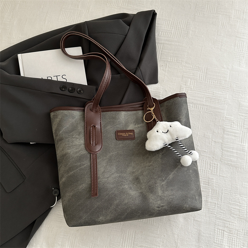 Bolso retro de gran capacidad para mujeres 2024 nueva moda textura bolso de hombro simple empalme bolso de viaje