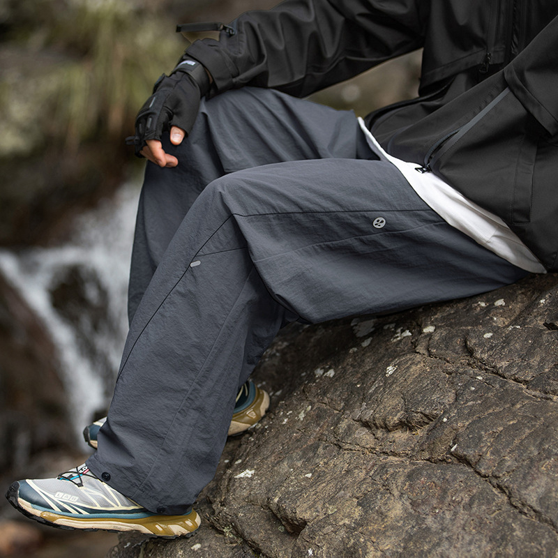Men's new outdoor workwear casual pants, water-resistant, with a split design, long pants, and adjustable four-button closure Men's new outdoor workwear casual pants, water-resistant, with a split design, long pants, and adjustable four-button closure