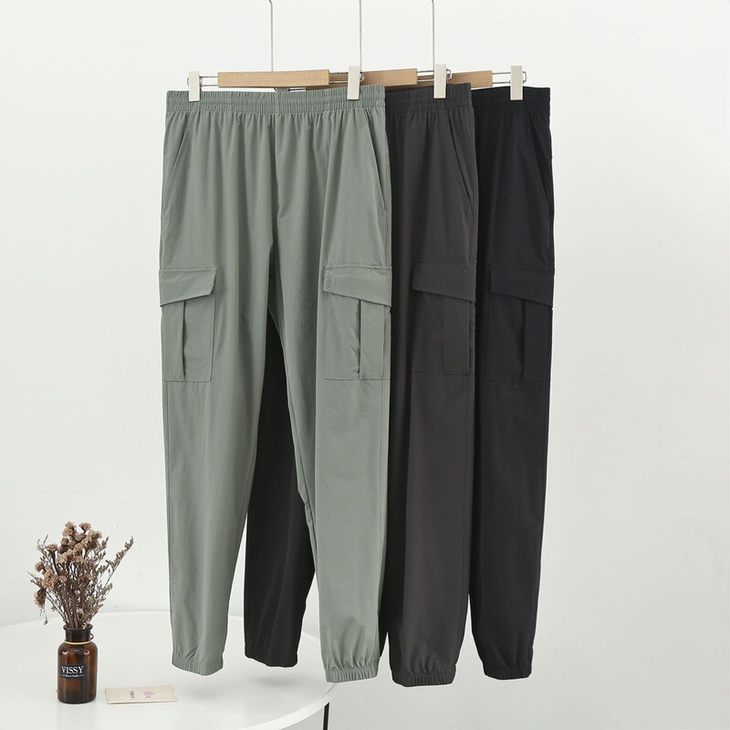 Spring and Autumn men's elastic waterproof outdoor leisure work sports trousers fashionable trendy men's loose comfortable drawstring pants