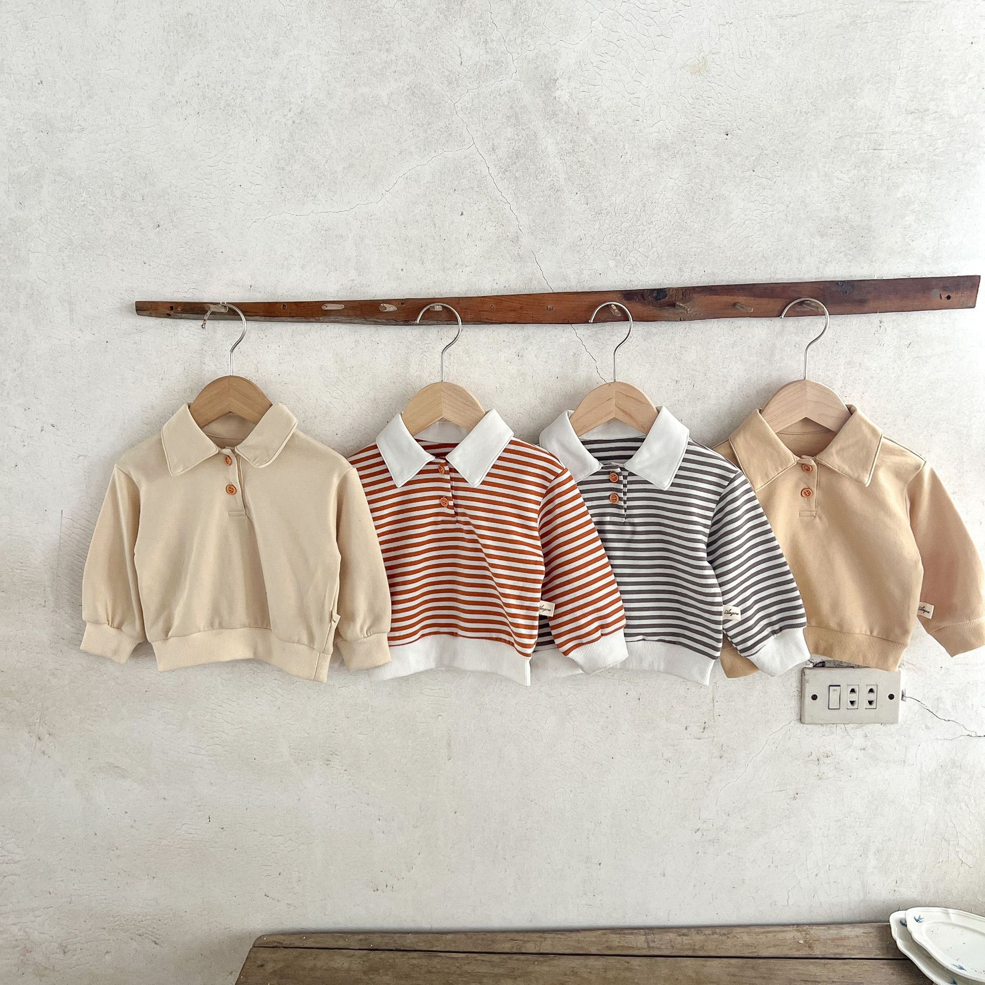 Estilo coreano ins suéter rayado del bebé neutral de los hombres flojos y niñas cuello POLO primavera superior