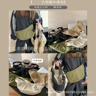 L牛角包大容量2025新休闲运动斜挎包时尚通勤饺子包多功能单肩包