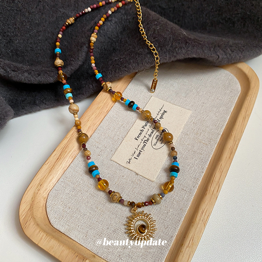 Acero de titanio piedra natural cuentas de arroz flor de sol collar con cuentas nueva cadena de clavícula retro china decoración de lujo ligero de alta gama mujeres