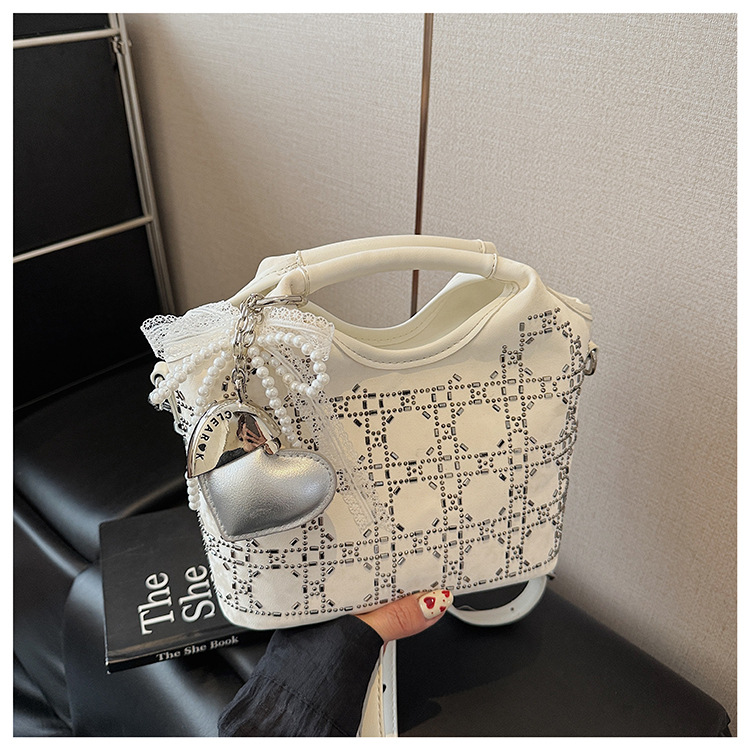Summer fashion women's versatile hand-held niche crossbody design 2025 simple crossbody bucket bag, new Korean style for commuting undefined