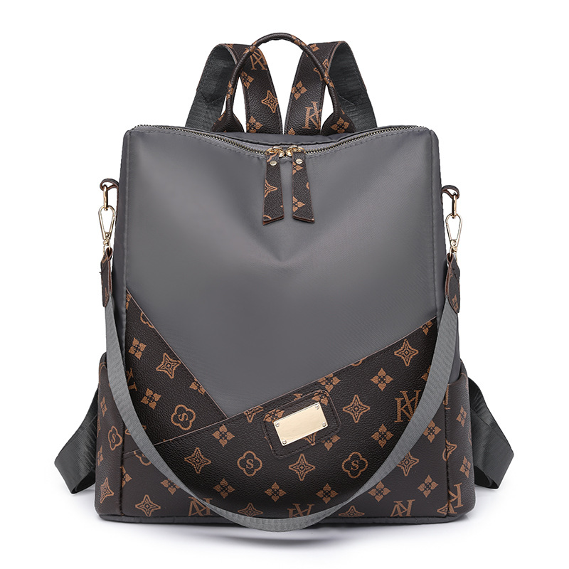 Comercio exterior al por mayor 2024 nueva moda europea y americana señoras mochila de nailon impresión color de contraste mochila de viaje de un solo hombro marea