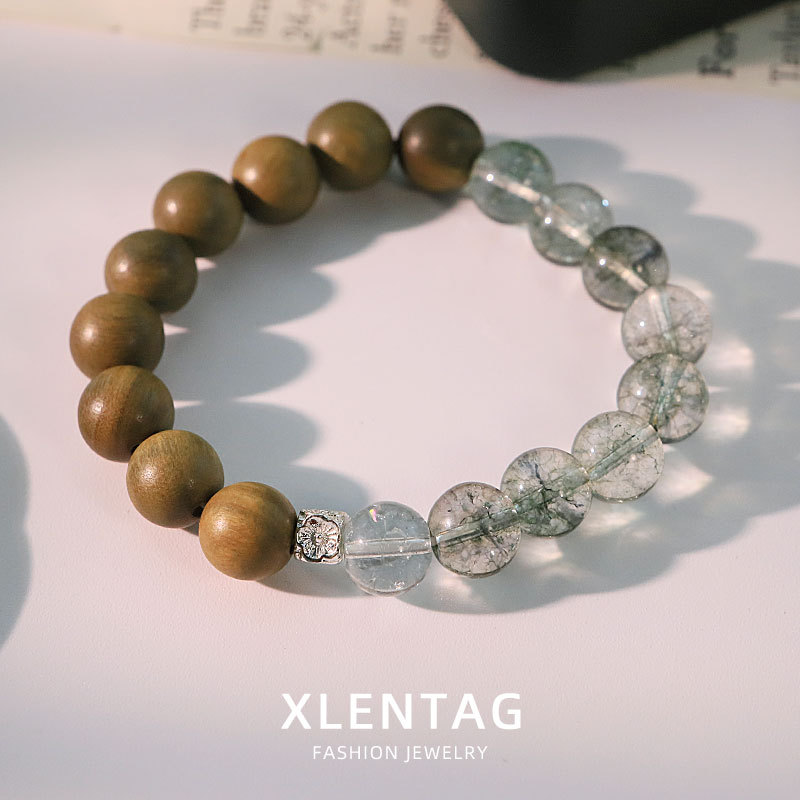 Diseño original de madera de sándalo grieta de cristal cuentas pulsera temperamento retro pulsera de moda versátil alta sensación joyas de la mano