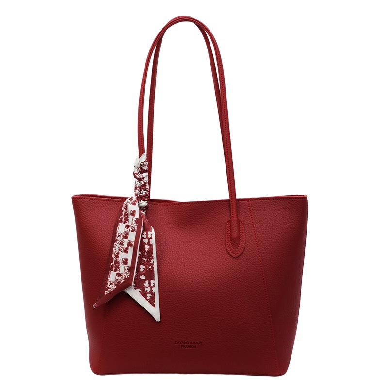 Bolso rojo de gran capacidad para mujeres versátil 2025 nuevo bolso de hombro casual simple para trabajar bolso de viaje