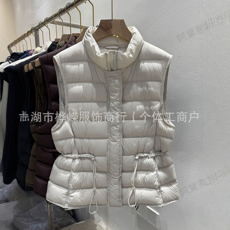 2026 new style 90% white duck down vest for women, with a stand-up collar, waist-cinching design, slimming effect, warmth, and sleeveless construction, suitable for wearing as an outer layer 2026 new style 90% white duck down vest for women, with a stand-up collar, waist-cinching design, slimming effect, warmth, and sleeveless construction, suitable for wearing as an outer layer