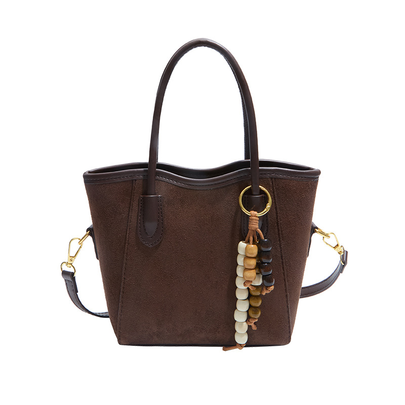 2025 otoño y invierno nuevo bolso de alta calidad bolso de cubo de agua universal bolso de hombro popular de mujer retro mochila esmerilado