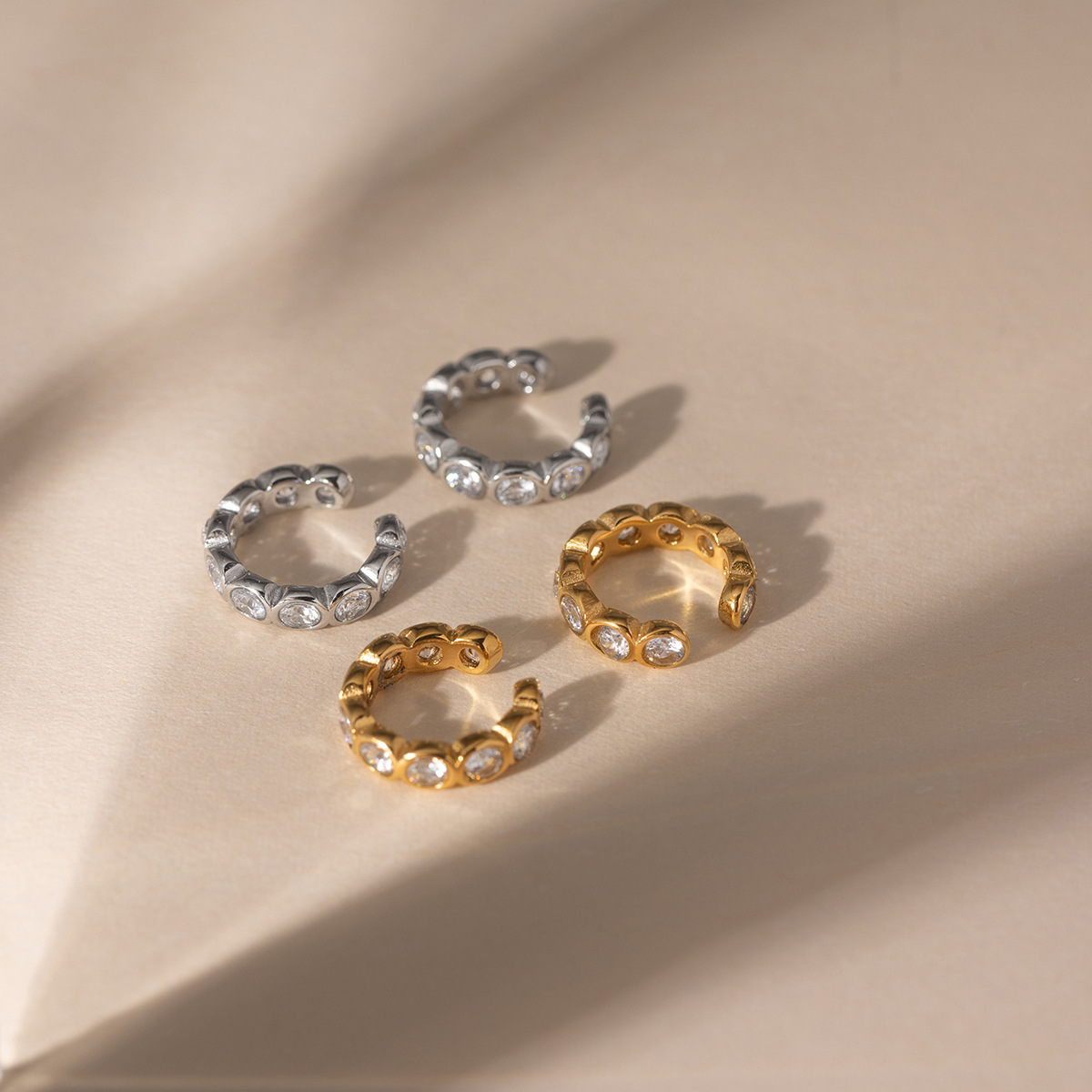 Wanxing europa y americana pendientes de zircon blanco ligero lujo alto sentido de joyería transfronteriza nicho diseño pendientes de acero inoxidable