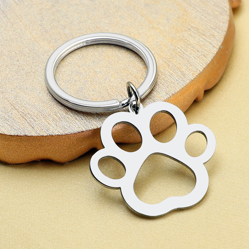 European and American Creative Gifts Stainless Steel Keychain Pet Collar Pendant Hollow Paw Pendant Bag Pendant