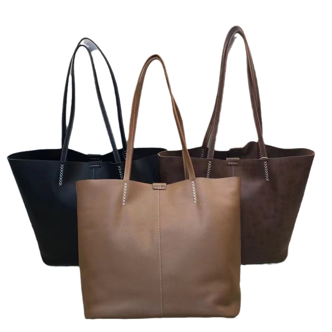 El nuevo tote de cuero de gran capacidad es retro y yangqi para viajar en todas las axilas, un bolso de hombro simple y portátil.