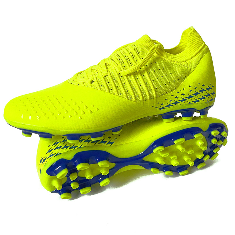 Zapatos de fútbol transfronterizos Putian sin costuras de tejido de vuelo para hombres, césped artificial, clavos largos, zapatos de entrenamiento para adolescentes adultos