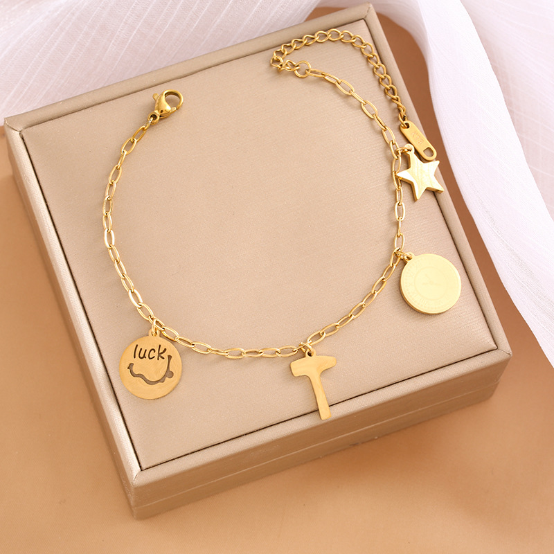 Pulsera de trébol de acero titanium vendedora caliente transfronteriza europea y americana con incrustaciones de concha pulsera colgante pulsera de diseño avanzado sin desvanecimiento al por mayor