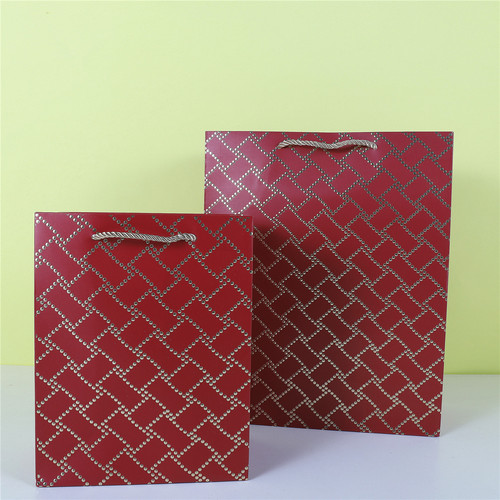 Threaded hot stamping white card gift bag irregular connection hot stamping platinum paper bag clothing shopping bag wholesale