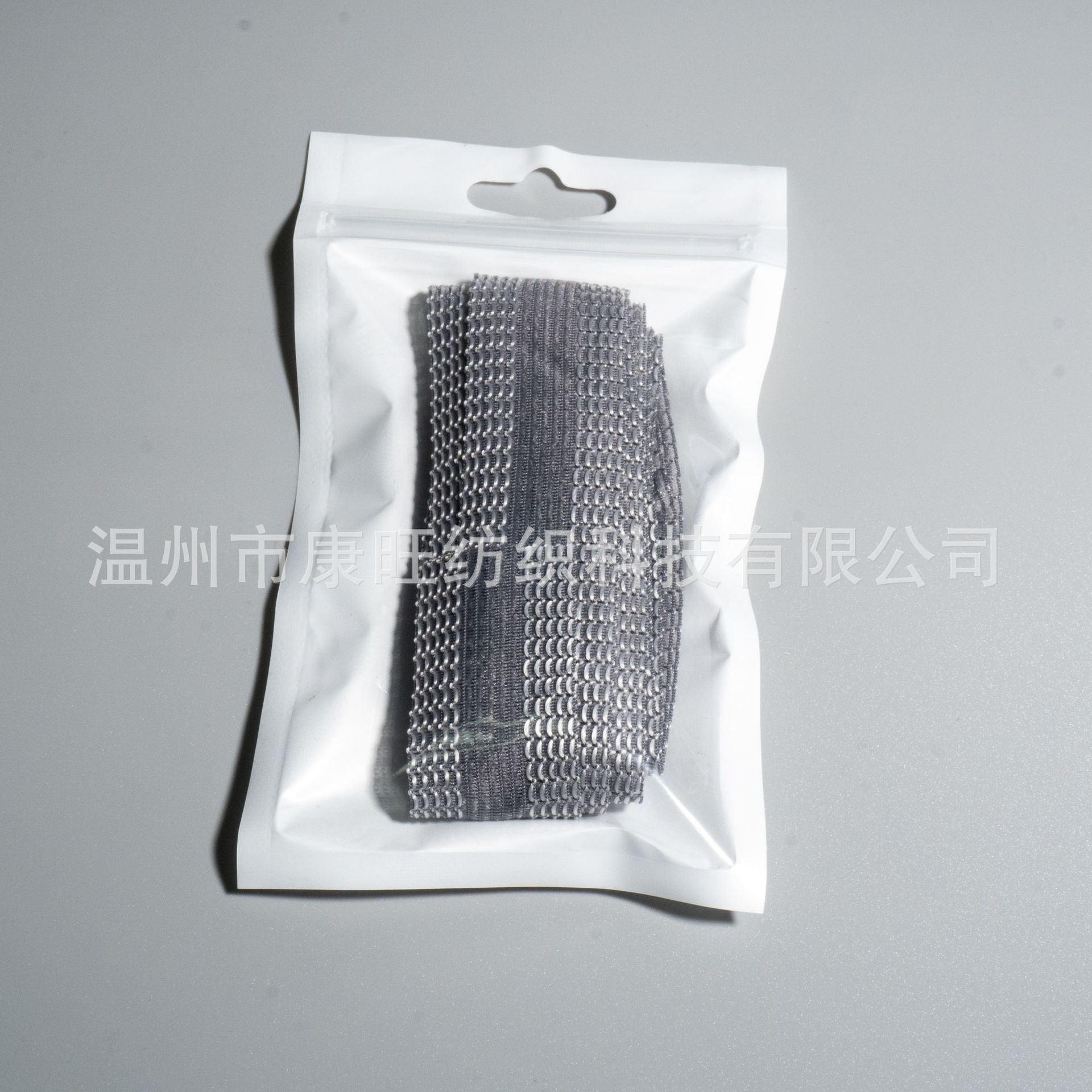 Los pantalones de la fábrica de Wenzhou se pegan en la boca del pantalón se acortan