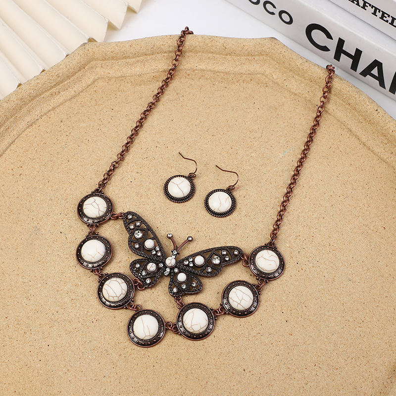Venta caliente transfronteriza Europea y Americana exagerada Bohemia vintage turquesa mariposa collar pendientes traje de fábrica de joyas al por mayor
