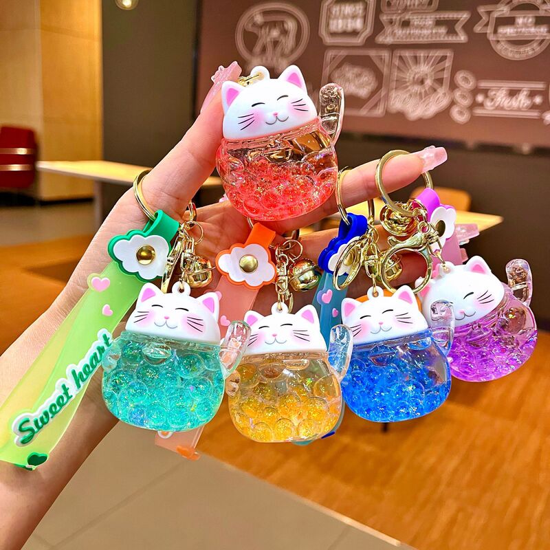 New oil lucky cat key chain cute liquid quicksand bottle car key chain pendant small gift wholesale New oil lucky cat key chain cute liquid quicksand bottle car key chain pendant small gift wholesale