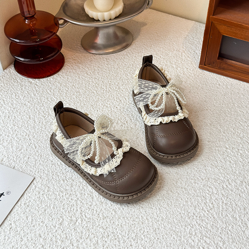 Zapatos de arco de encaje de niñas 2026 verano nuevo estilo de moda infantil zapatos de princesa universal zapatos Lefour huecos