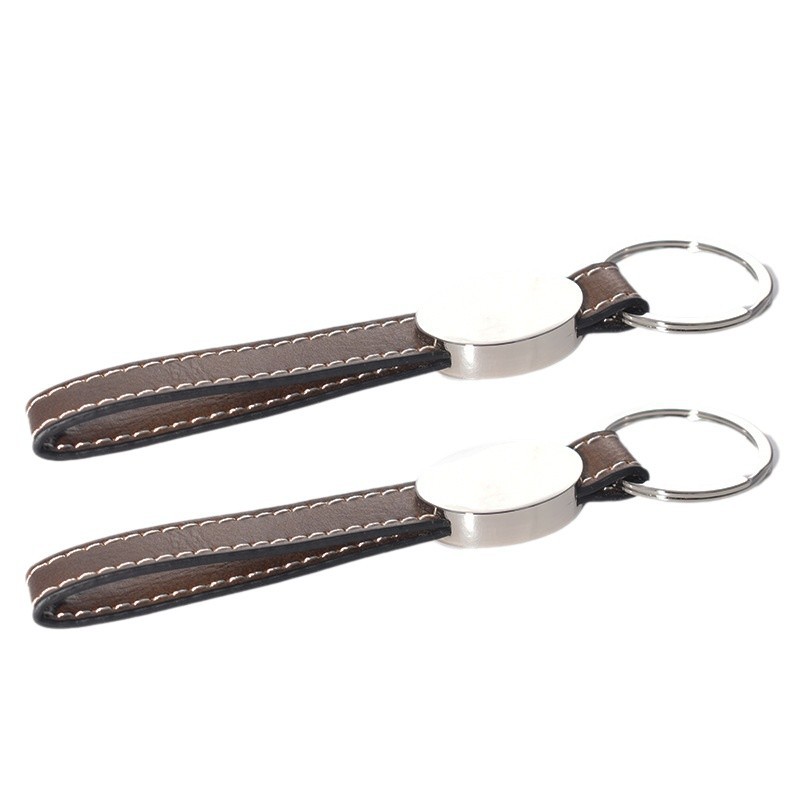 Transfronterizos en blanco spot embrión láser de cuero llavero de metal cuero colgante de automóvil personalizado regalos de negocios de alta calidad