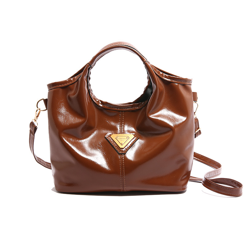 Bolso de mano de textura para mujeres 2024 otoño y invierno nuevo estilo retro de moda empalme de gran capacidad de viaje de hombro bolso de mujer