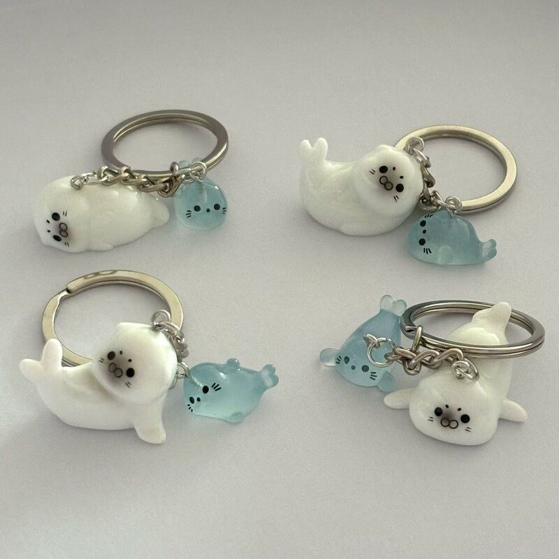 Hot-Selling Cute Cartoon 3D Glow-In-The-Dark Sea Lion Set Keychain - Suitable for Bags, Keys, and More