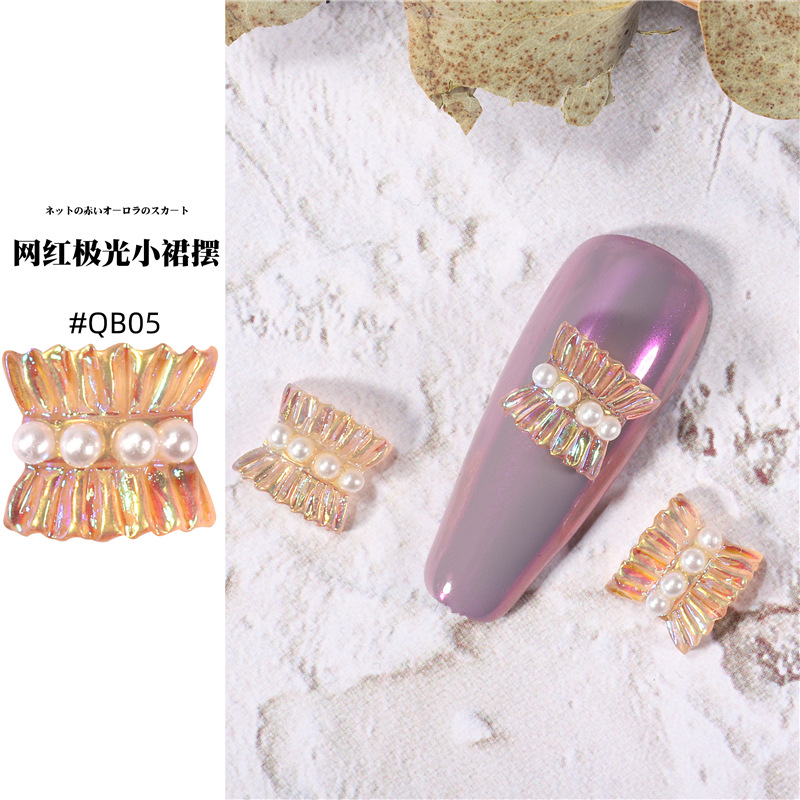 Accesorios de falda de arte de uñas 2021 nueva celebridad de Internet pequeño libro rojo estilo caliente hada aurora falda plisada decoración de uñas