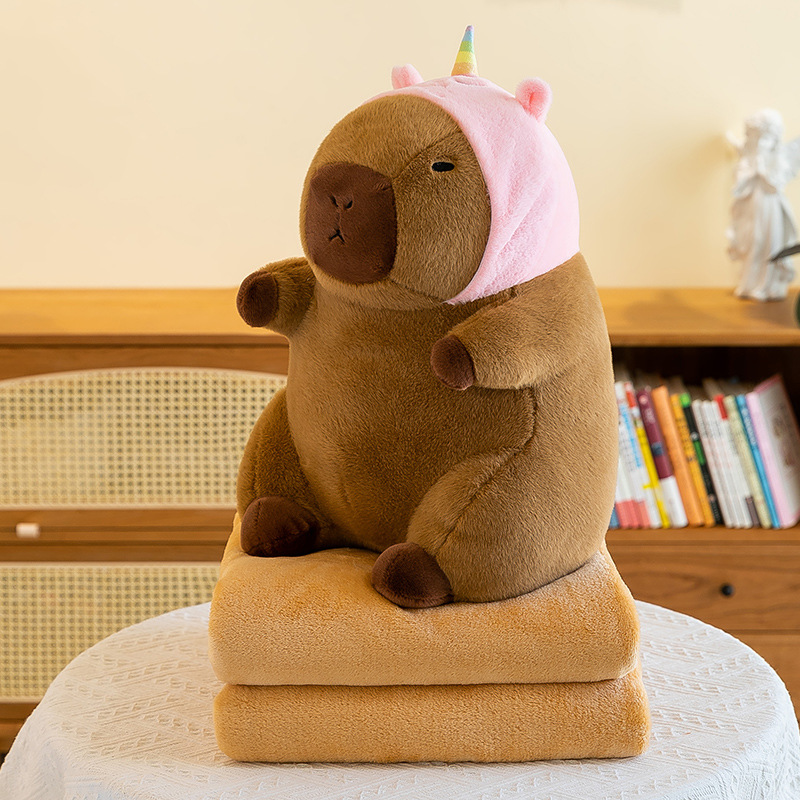 Caricatura capibara almohada manta dos en uno Carpibara cojín aire acondicionado es de doble uso niños siesta manta regalo