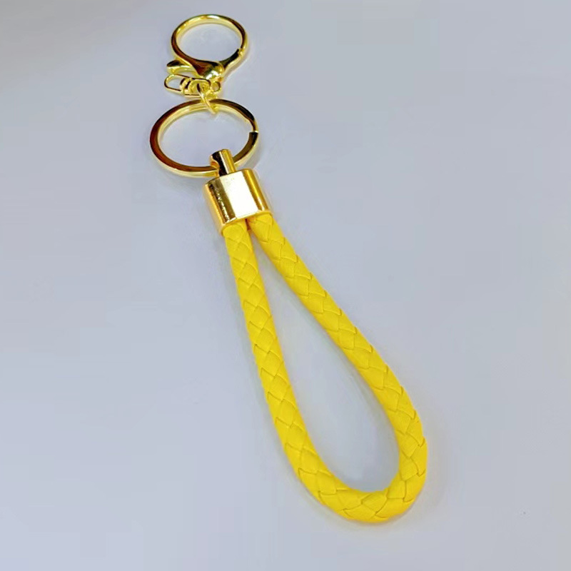 Ronda de la langosta hebilla PU cuero trenzado cuerda llavero hombres y mujeres amor llavero mano cuerda bolsa cordón fábrica directa al por mayor