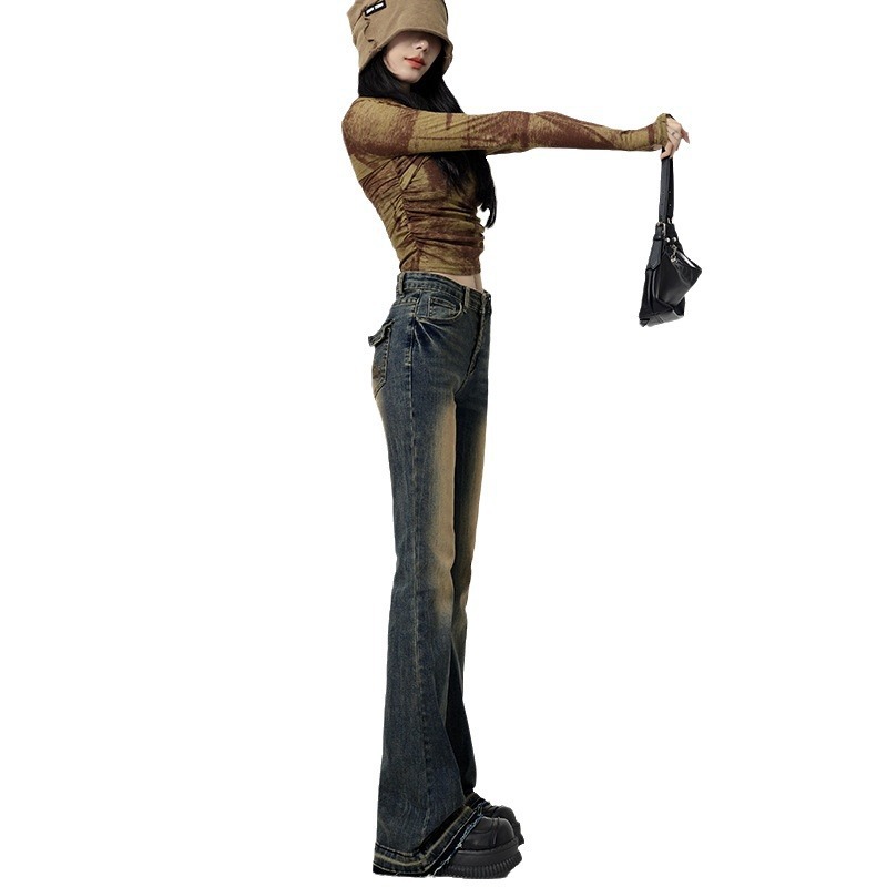 レトロな水洗いのジーパンの女性の腰の小さいラッパの2025の新型の秋のアメリカの毛の縁の設計感のラッパの馬蹄のズボン