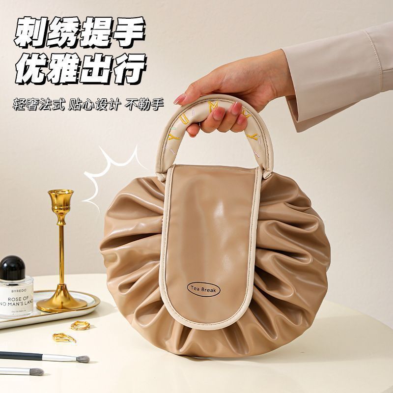 Perezoso 2025 nuevo paquete de maquillaje impermeable de gran capacidad portátil bolsa de almacenamiento de viaje cuerda de bombeo para lavar