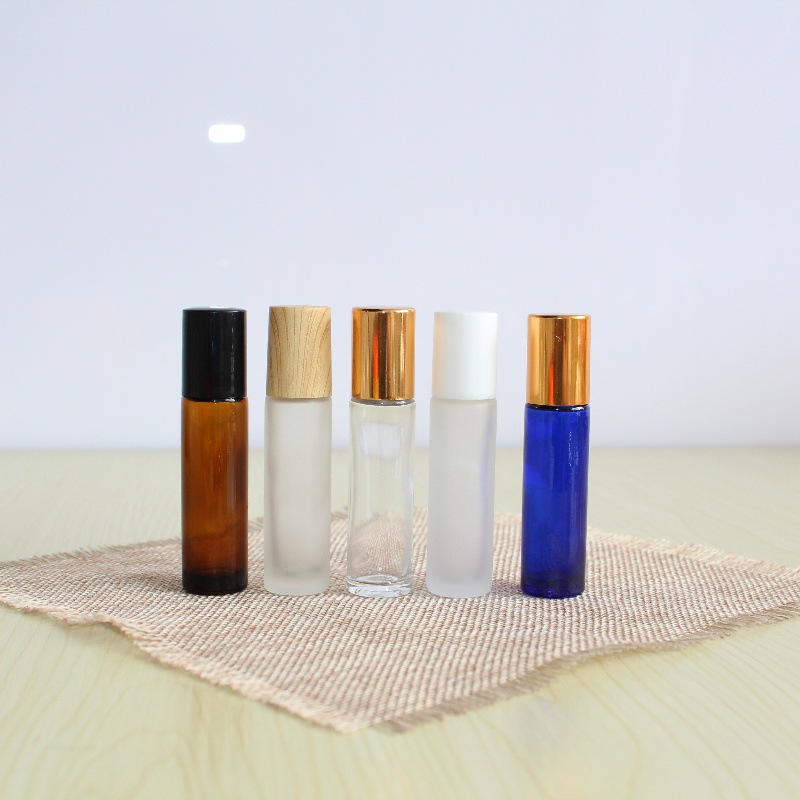 En stock al por mayor 5ml10ml botella de bola de rodillo botella de vidrio de cuentas transparente esmerilado marrón muestra de aceite esencial sub-embalaje botella vacía