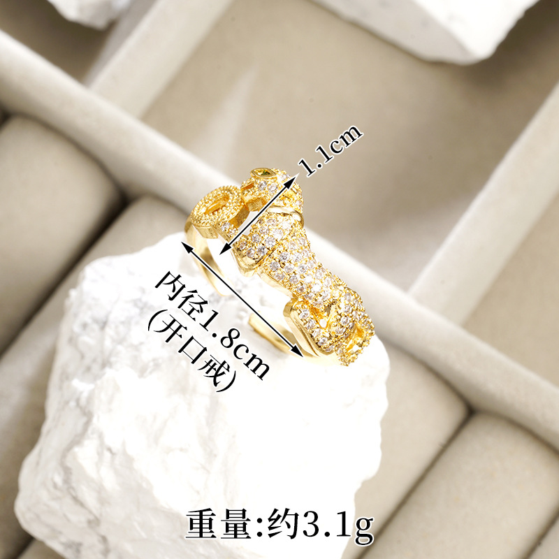 Nuevos productos de oro de arena galvanizado 18k pulsera de fijación ligera de lujo ojos verdes cabeza de leopardo hueco anillo de alquiler no se pierde joyería