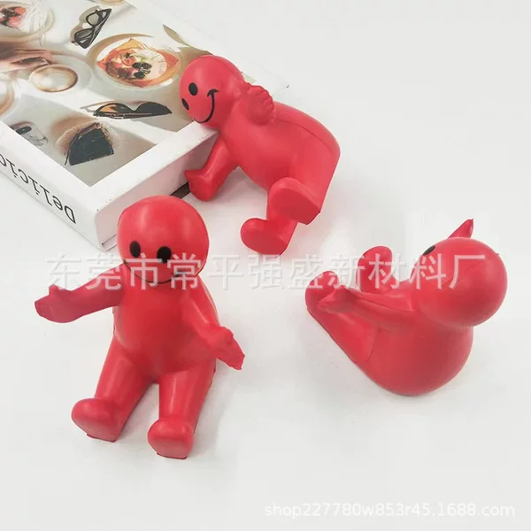 pu foam material villain mobile phone holder pu cartoon character mobile phone holder printable LOGO