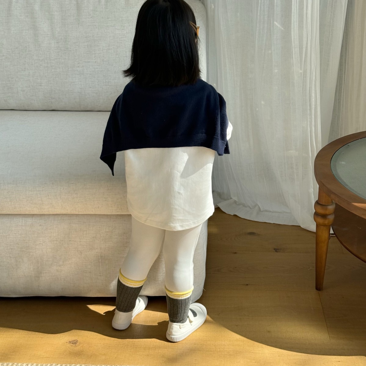 Curled yellow striped children's socks in kindergarten to go to…