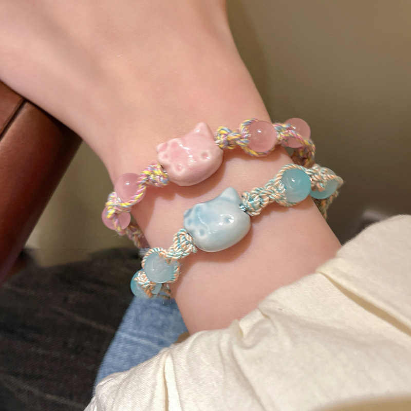 Pulsera de cuerda de color de gatito de cerámica linda de dibujos animados, pulsera de todo fósforo de nicho dulce, joyería de temperamento de alta gama de moda para mujer