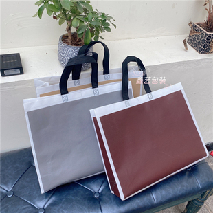 Black and White Checkered Non-Woven Waterproof Ins Duty-Free Store Wholesale Laminated Shopping Bag Clothing Bag Packing Travel Tote Bag