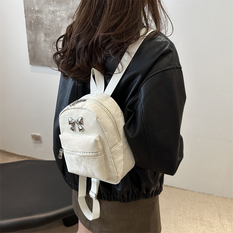 Mochila de arco para mujeres, estilo de estilo casual, moda coreana, mochila de balde, mochila de viaje pequeña y ligera
