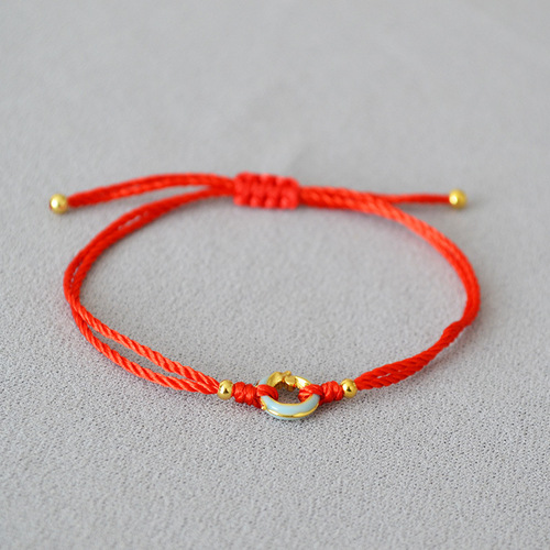 A unique, minimalist Chinese-style zodiac red rope braided Qinglong jade pendant bracelet with a circular clasp for adjustable closure, exuding elegance and personality.