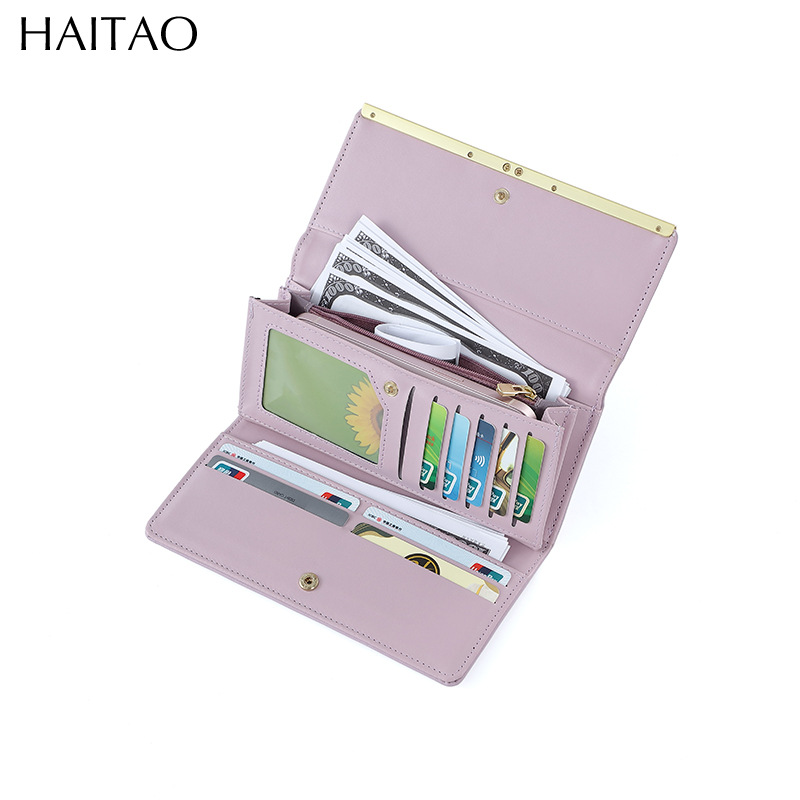 Nueva cartera larga para mujer, bolso de mano tipo clutch de color sólido de alta gama, cartera de cuero genuino al por mayor.